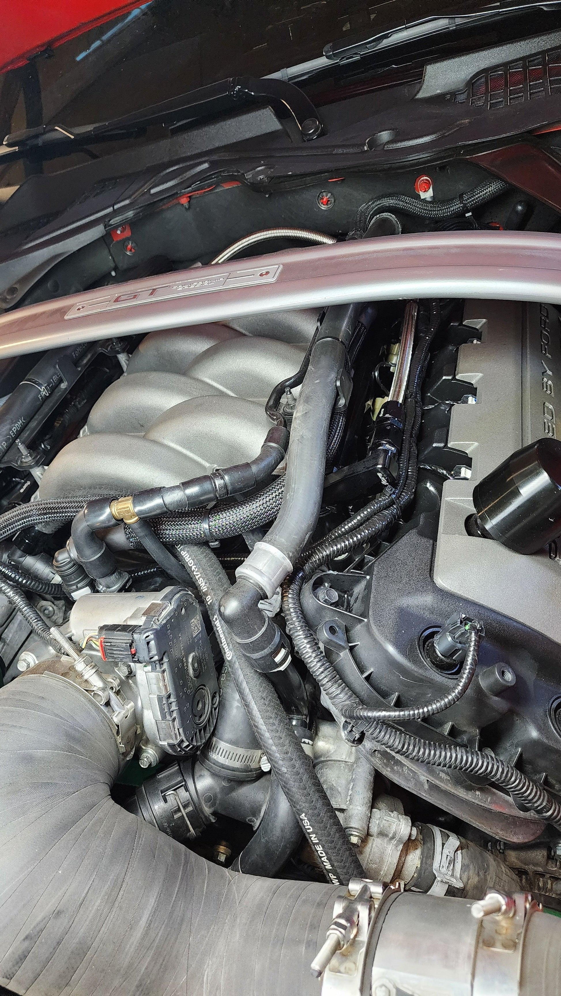 Showing what can still be seen of the Nocturnal Automotive / Auto EVAP solenoid relocation from the front of the engine bay, 2017 mustang gt gen 2 coyote, with gen 3 2018+ intake manifold upgrade